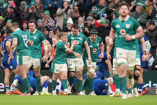 Ireland’s Jack Conan, centre, celebrates with team-mates after his try against Italy